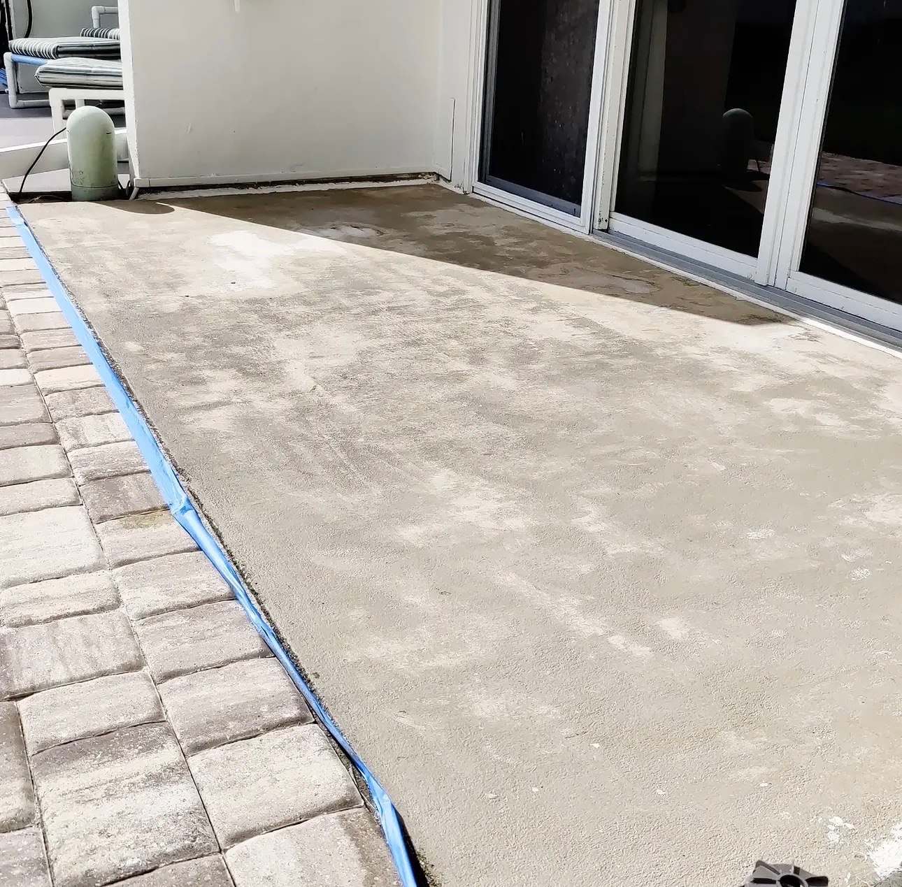 Concrete patio before painting — bare, stained slab